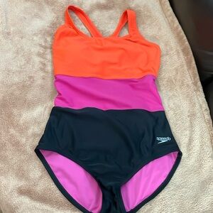 Speedo swim suit.